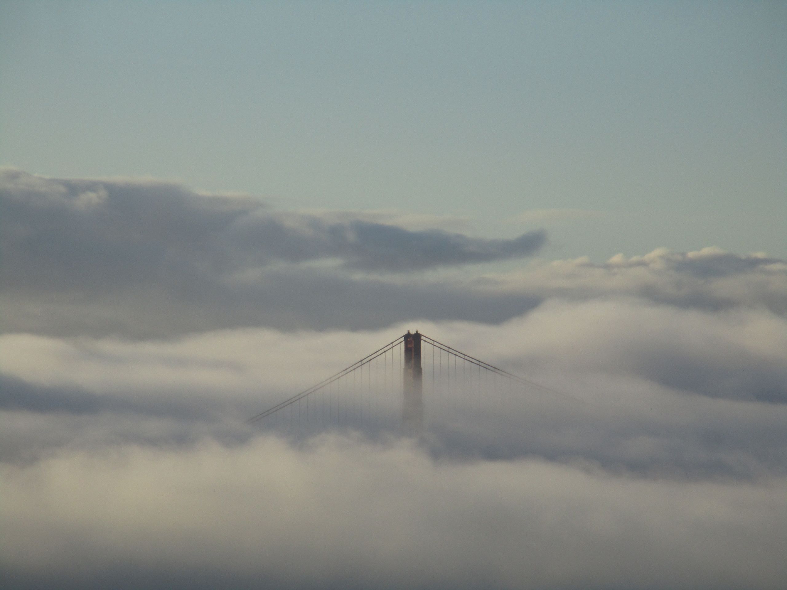 Golden Gate Bridge disappearing in fog, California, USA
