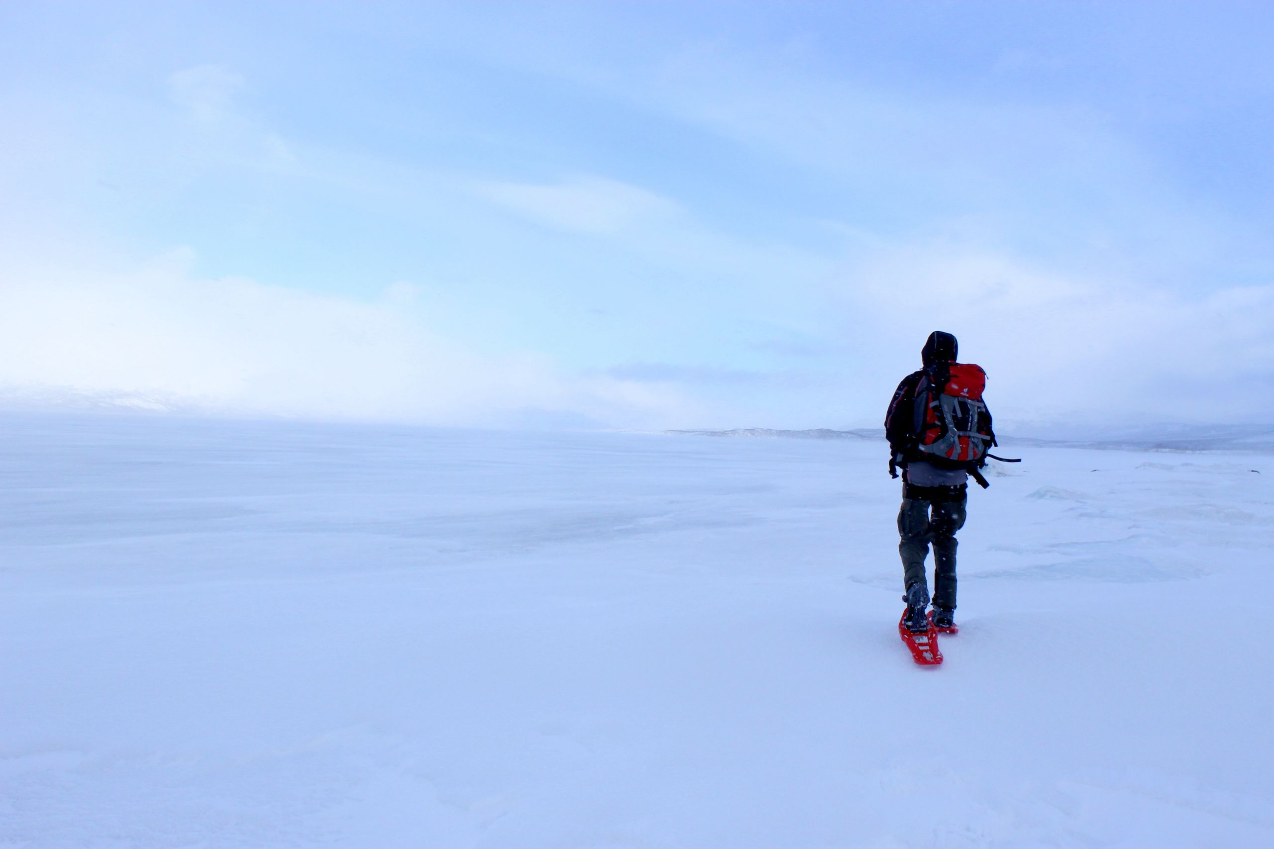 Hiking on the frozen Torneträsk lake, Sweden